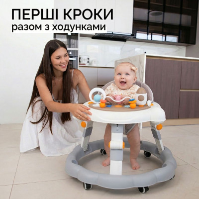 Дитячі ходунки з музичною ігровою панеллю столиком для дітей 7-18 місяців регулювання висоти на коліщатках